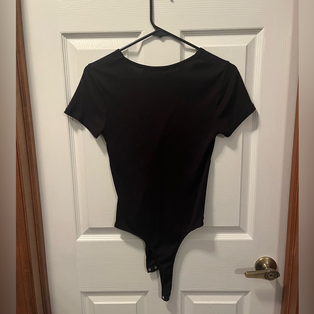 POOF New York Small black body suit with knot in the front middle
